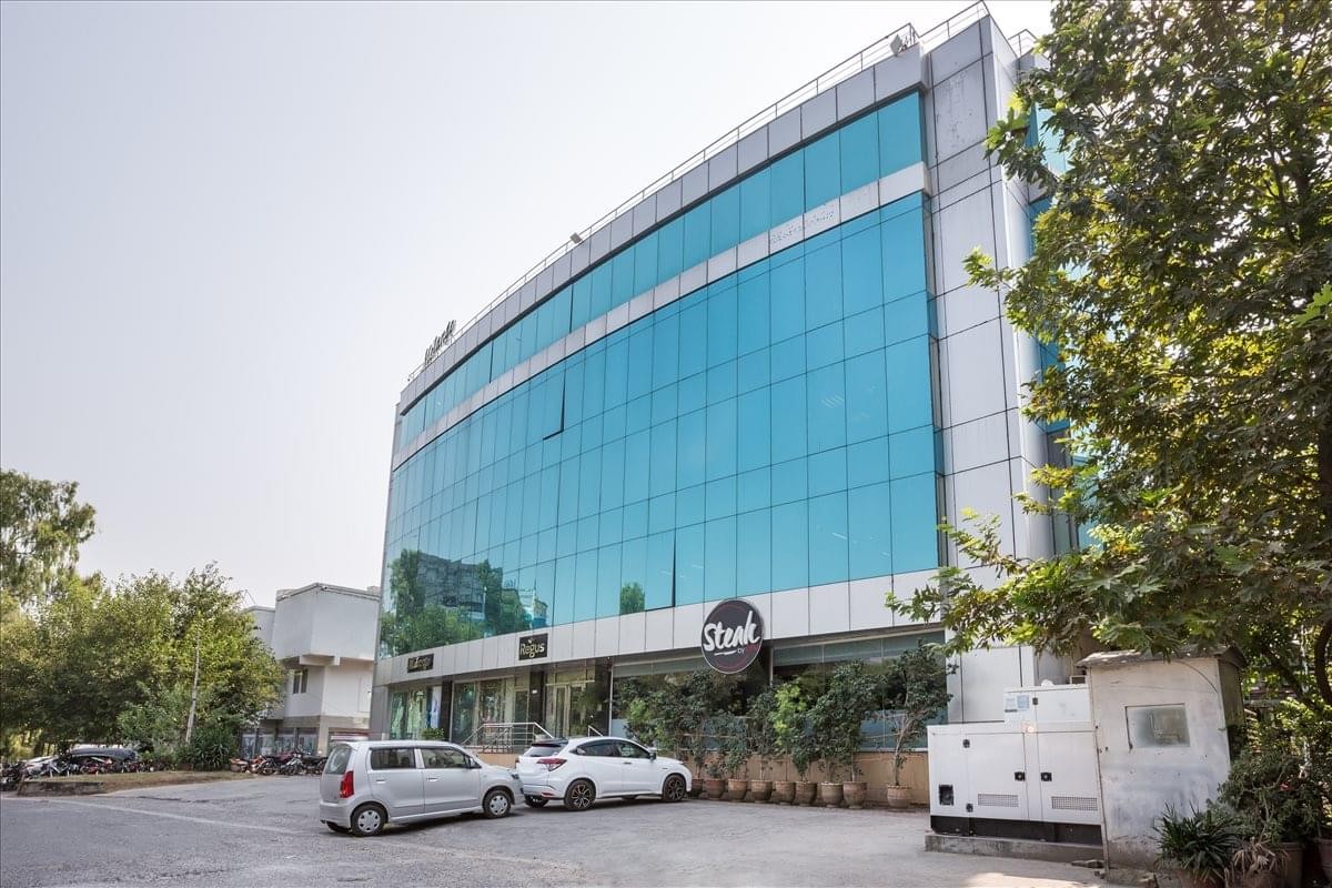 Exterior view of the glass-facade Emirates Tower at Markaz Islamabad.