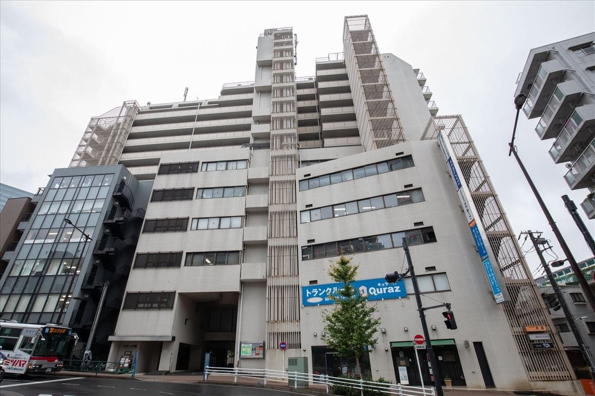 Exterior view of the multi-story Estage Osaki Building on a city corner.