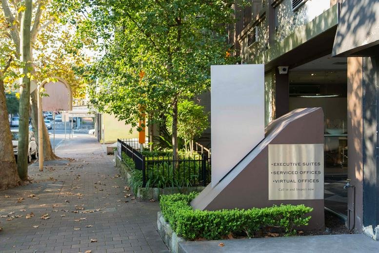 Exterior street view showing the entrance and signage of the Executive Centre at 119 Willoughby Road.