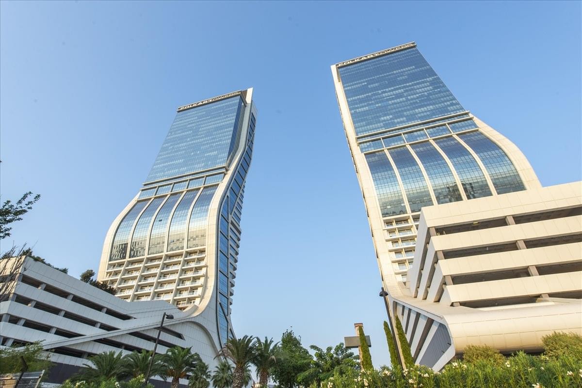 Exterior view of the striking curved twin towers at Folkart Towers in Izmir.