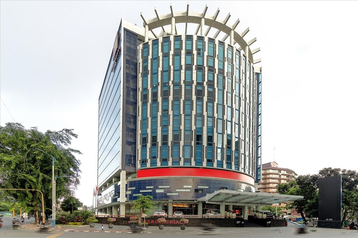 Exterior view of the modern, glass-facade Forum Nine building in Medan.
