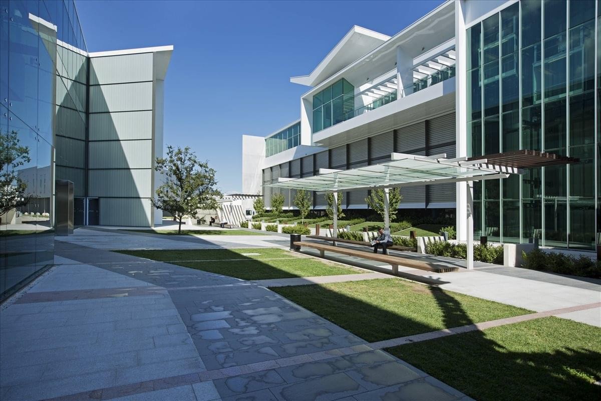 Exterior of the Gateway Business Center at Canberra Airport featuring modern glass and metal facades.