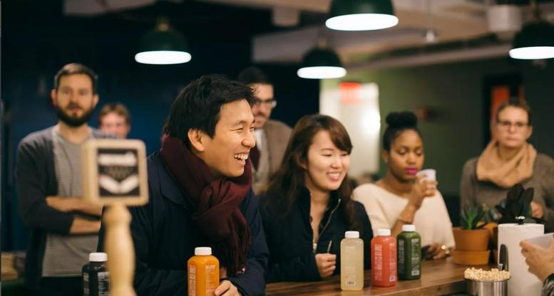 People socializing at a modern juice bar at Guanghua Lu, 10 Jintong West Road, Chaoyang District, Beijing.
