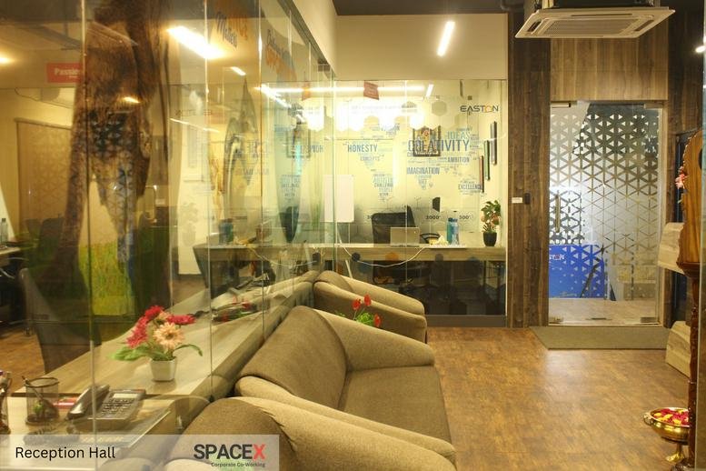 Reception hall at Flat No. S7, 1st Floor, SIDCO Guindy Industrial Estate with wood floors and modern glass walls.