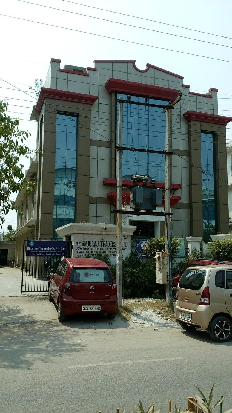 Exterior view of the multi-story commercial building at H Block, Sector 63, Noida, India.