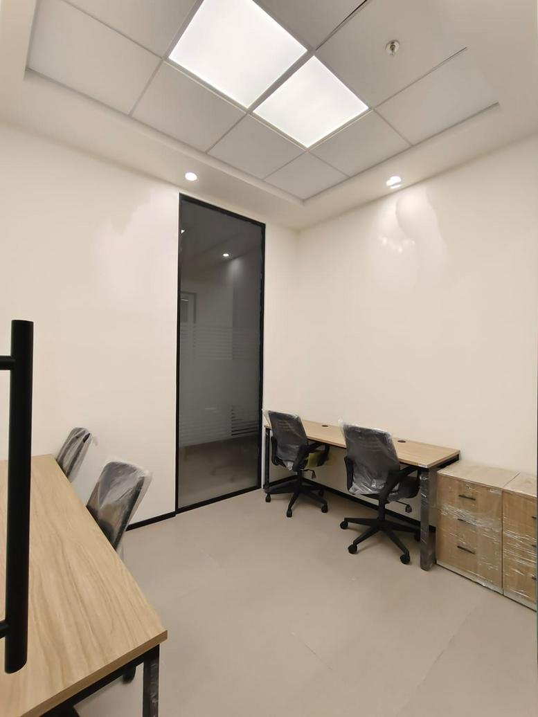 Bright executive suite at H&H Business Arcade with warm wood tones and a slatted ceiling.
