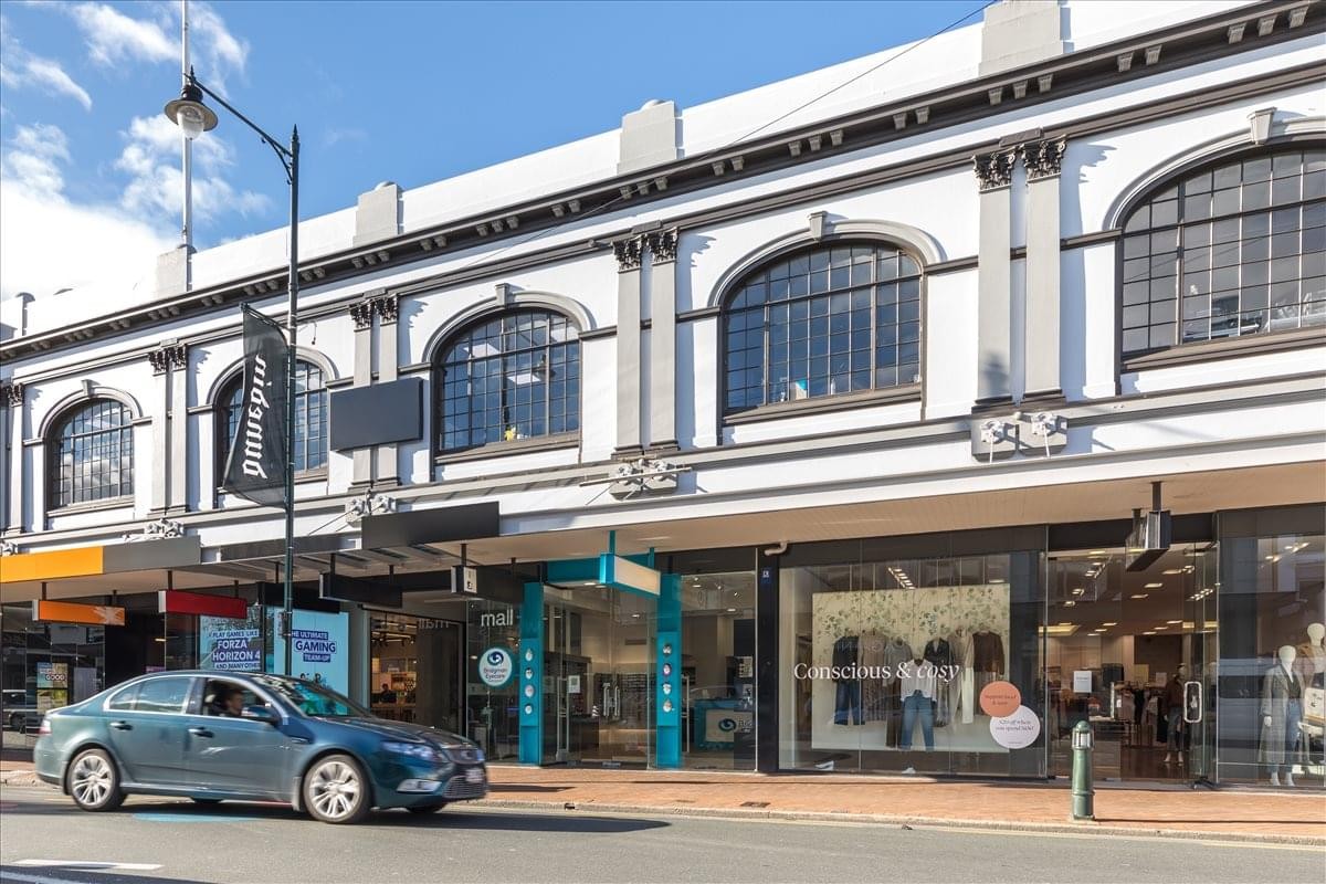 Exterior view of the historic white facade at Harvest Court, 218 George Street.