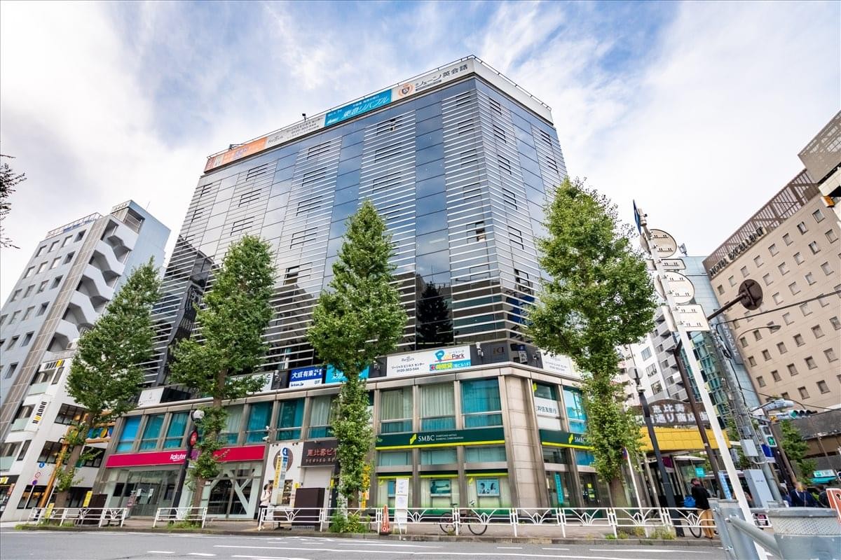 Exterior view of the glass-facade Humax Ebisu building in the city center.