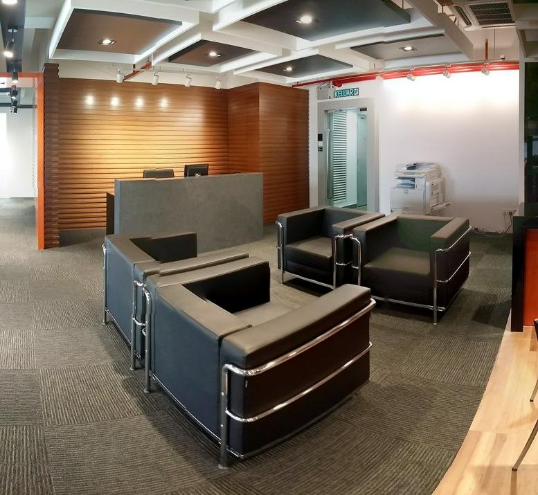 Modern reception lobby at I-01-05, 5th Floor, Block I, Setia Walk with wood-slat walls and leather armchairs.