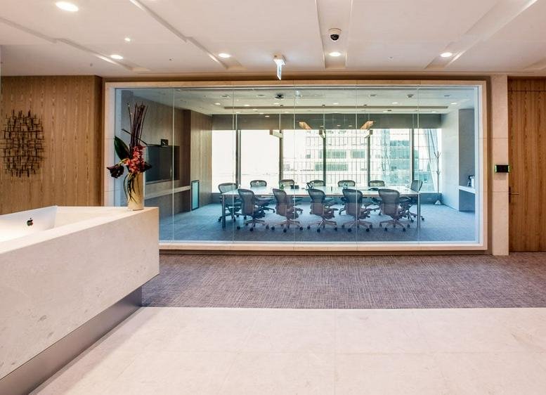 Reception area with a white marble desk at Level 43, International Finance Centre Seoul, Three IFC.