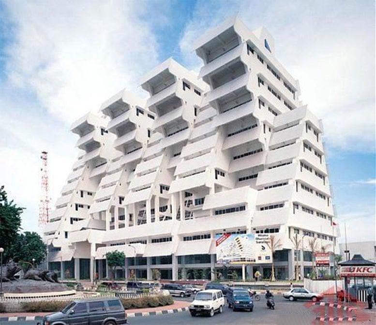Exterior view of Intiland Tower 2 showing a modern, multi-level facade.