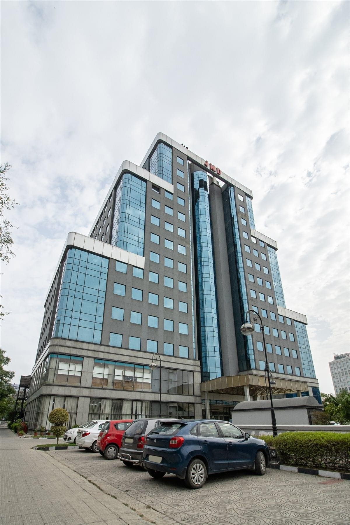 Exterior view of the contemporary glass and stone facade at JMD Regent Square.