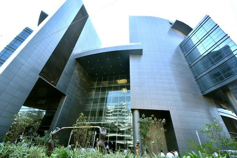 Wide-angle view of the sleek, grey-toned exterior architecture of the Kaledonia HDIL Building.