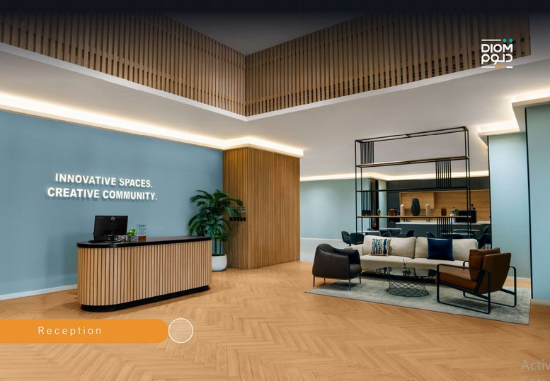 Warm, brightly lit reception at DIOM HQ, Century Corner, featuring a modern desk and wood slatted ceiling.
