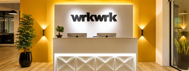 Reception desk with branded signage at wrkwrk, NH 66, Kottara Chowki, Mangaluru, India.