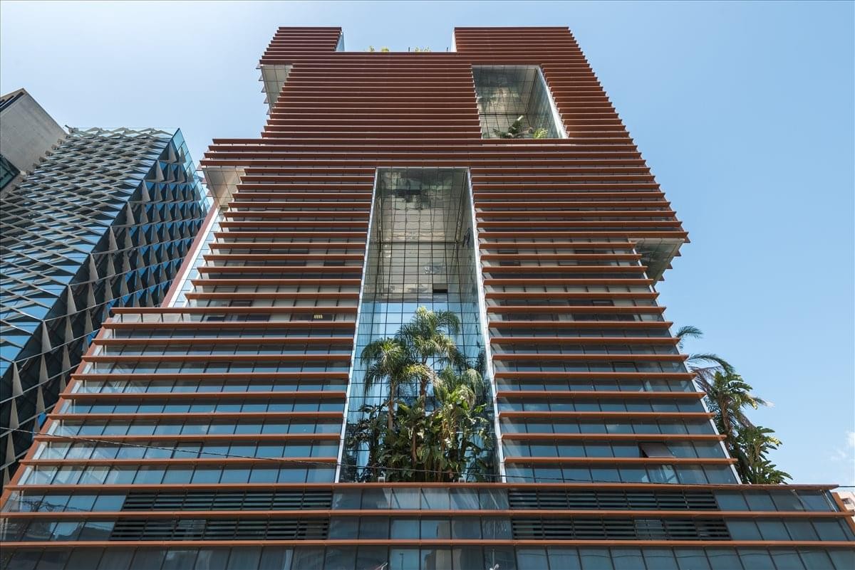 Exterior view of the contemporary brown-hued facade of the Le Bureau Building.