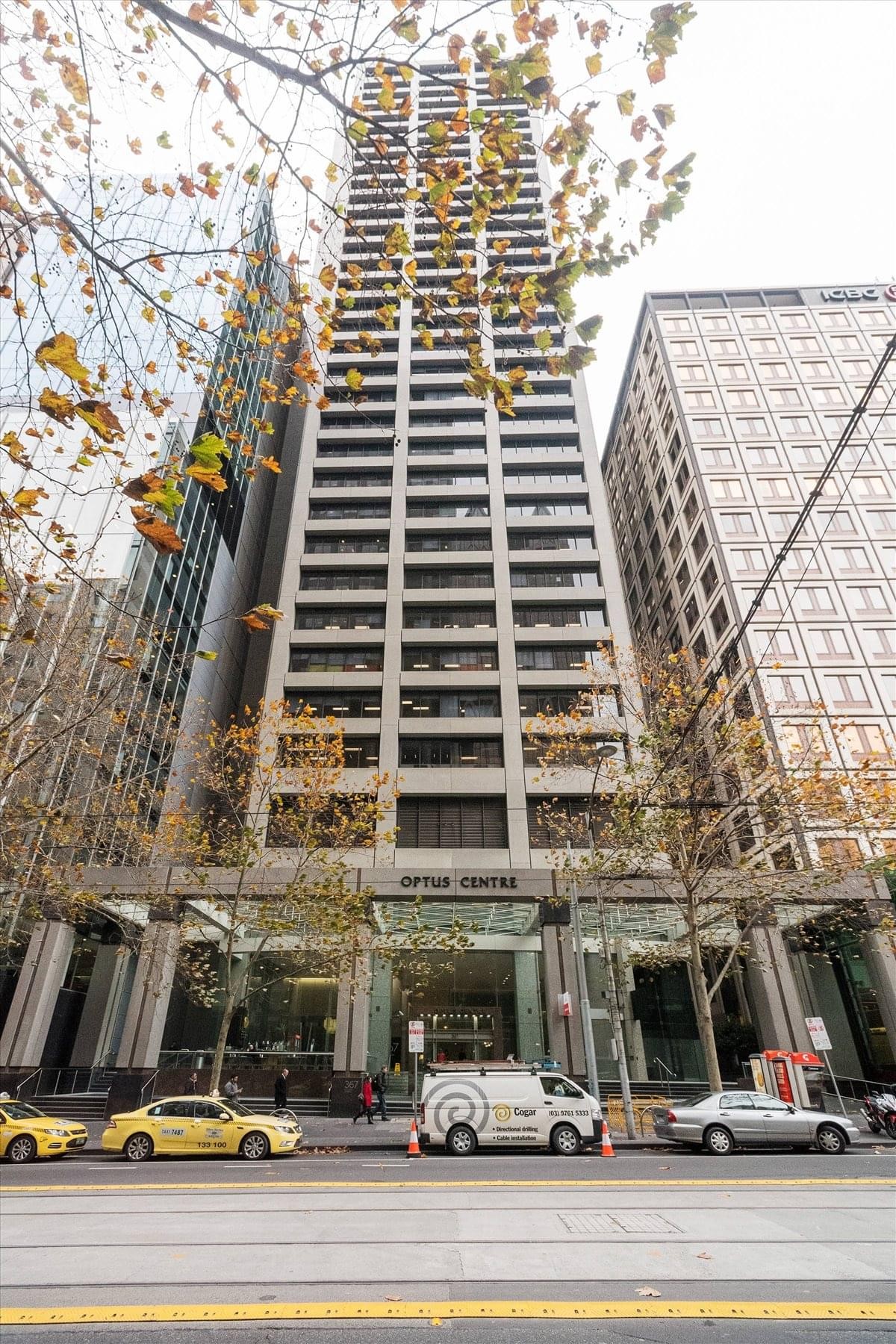 Looking up at the impressive skyscraper exterior of the Optus Centre on Collins Street.