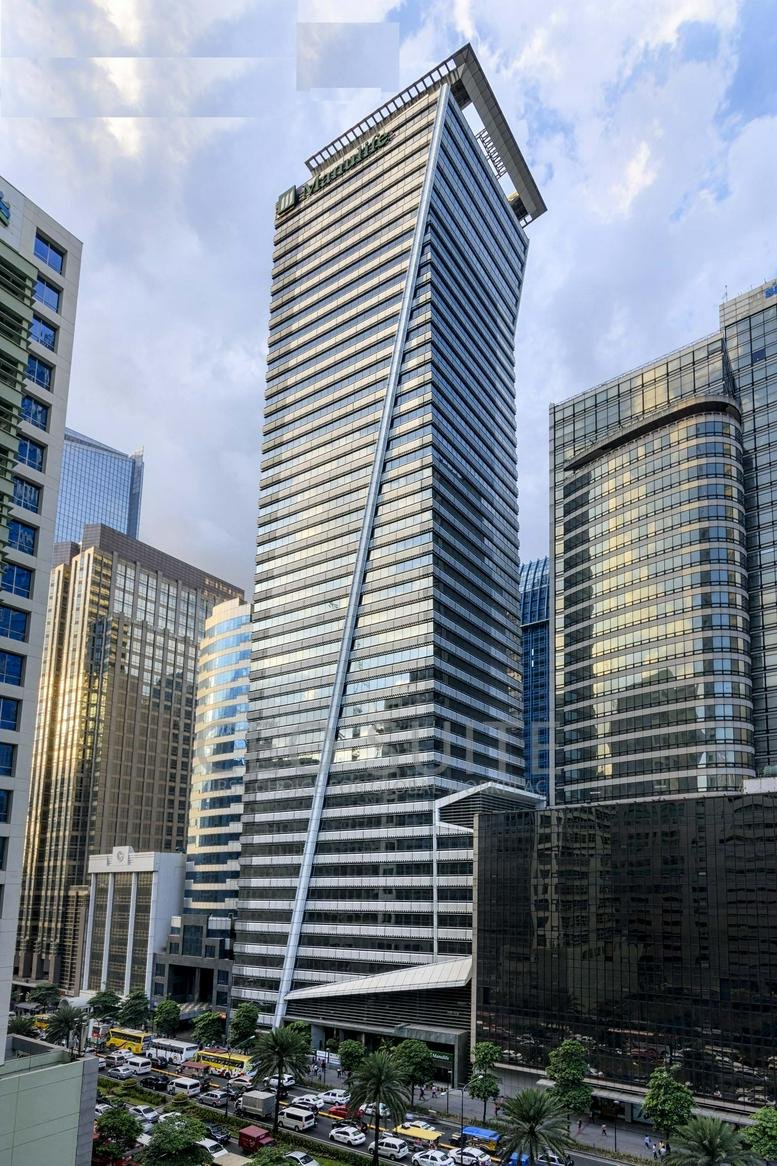 Exterior view of the glass-facade LKG Tower, 37th Floor, 6801 Ayala Avenue.