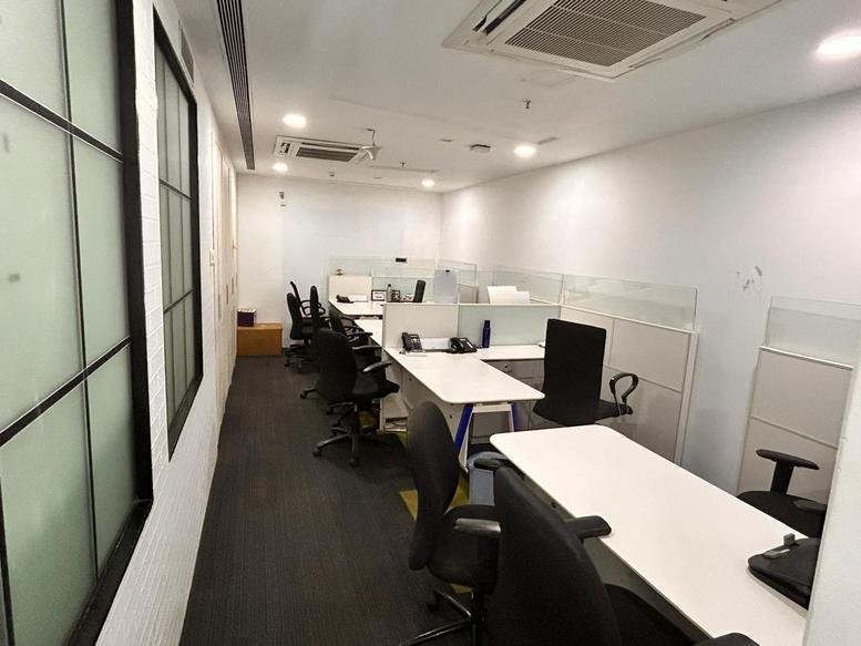 Private office suite at Lotus Corporate Park with multiple desks and ergonomic chairs.