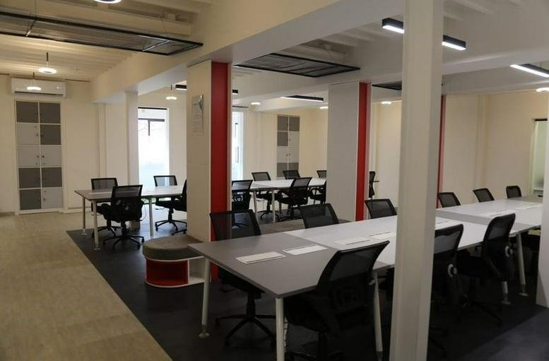 Wide view of a bright communal coworking area at M G Road, Ballard Estate, Fort, Mumbai, Maharashtra.