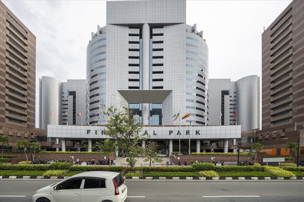 Exterior view of the Financial Park Labuan Complex featuring a modern symmetrical facade with central glass entrance.