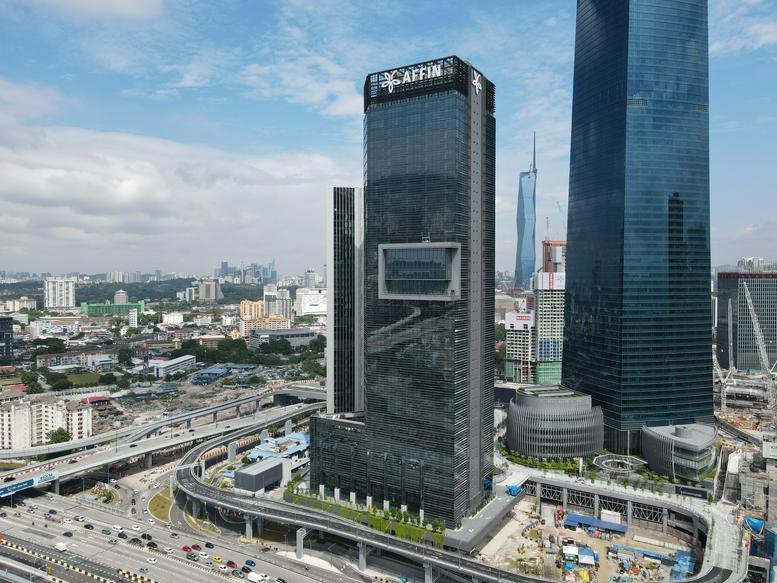Exterior view of the dark glass facade of Menara Affin in Tun Razak Exchange.
