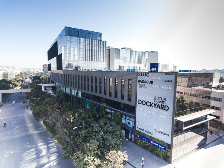 Exterior view of the contemporary glass and steel facade at Mfar Greenheart.