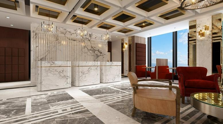 Grand marble reception area with elegant white counters, red velvet armchairs, and a coffered ceiling.