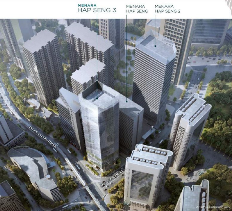 Aerial view of the modern skyscraper surrounded by lush greenery and city streets.