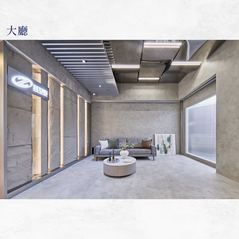 Modern lobby area at No. 167 Sec. 1 Fuxing S. Rd. with stone-textured walls and recessed lighting.