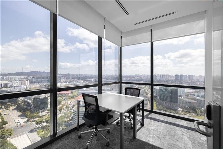 Panoramic office with glass walls offering cityscape views.