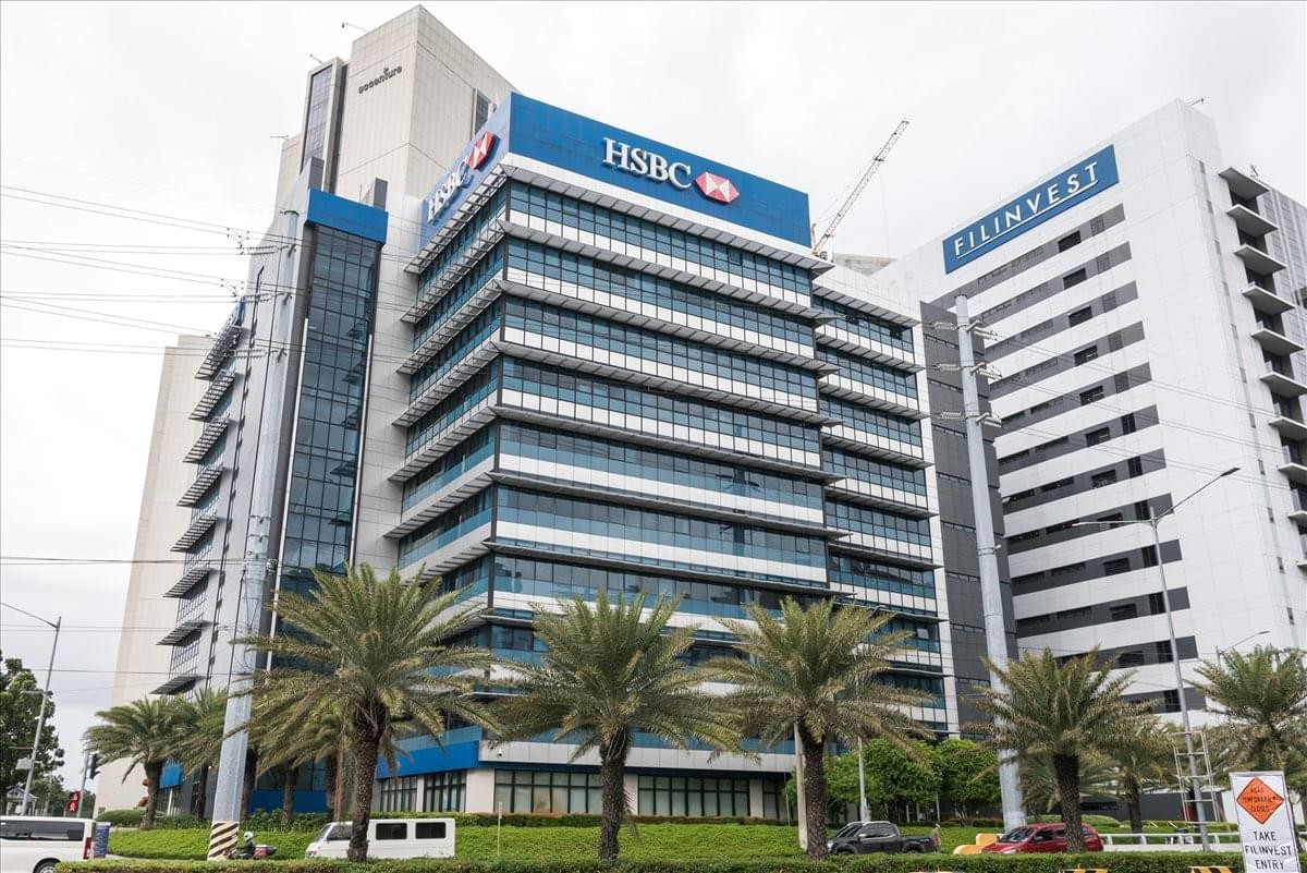 Exterior view of the multi-story glass-facade 9/F Filinvest One Building.