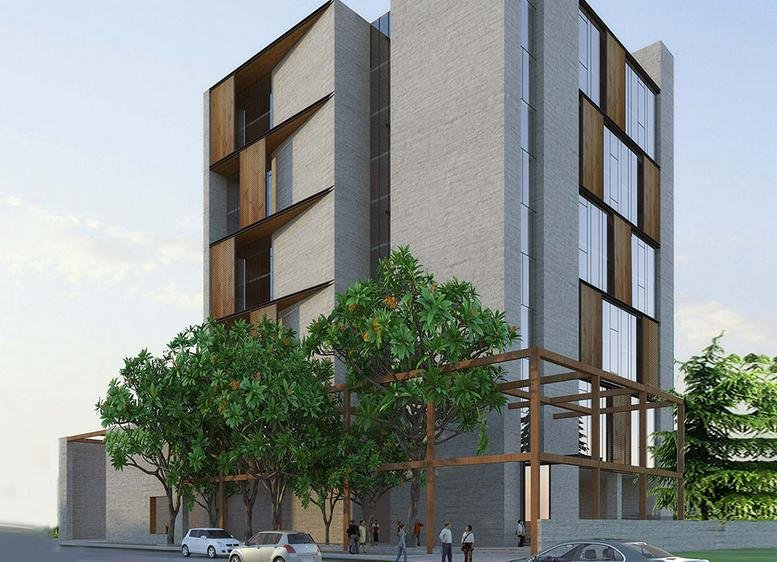 Exterior view of the modern multi-story Olympia Teknos building with wooden facade accents.