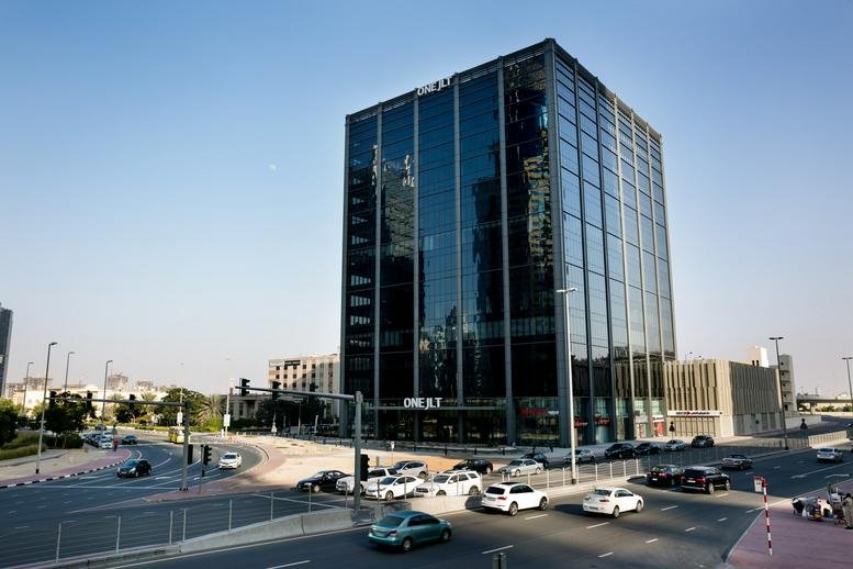Exterior view of the glass-facade One JLT, Jumeirah Lakes Towers building in Dubai.
