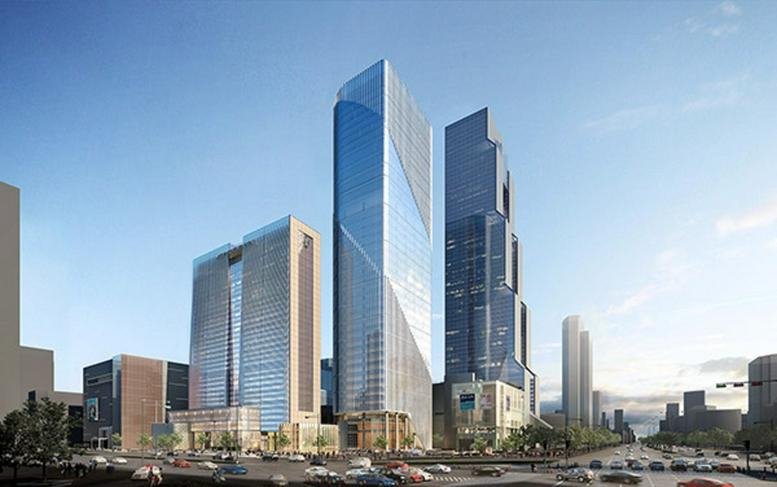 Exterior view of the sleek, glass-facade Parnas Tower set against a clear blue sky in Seoul.