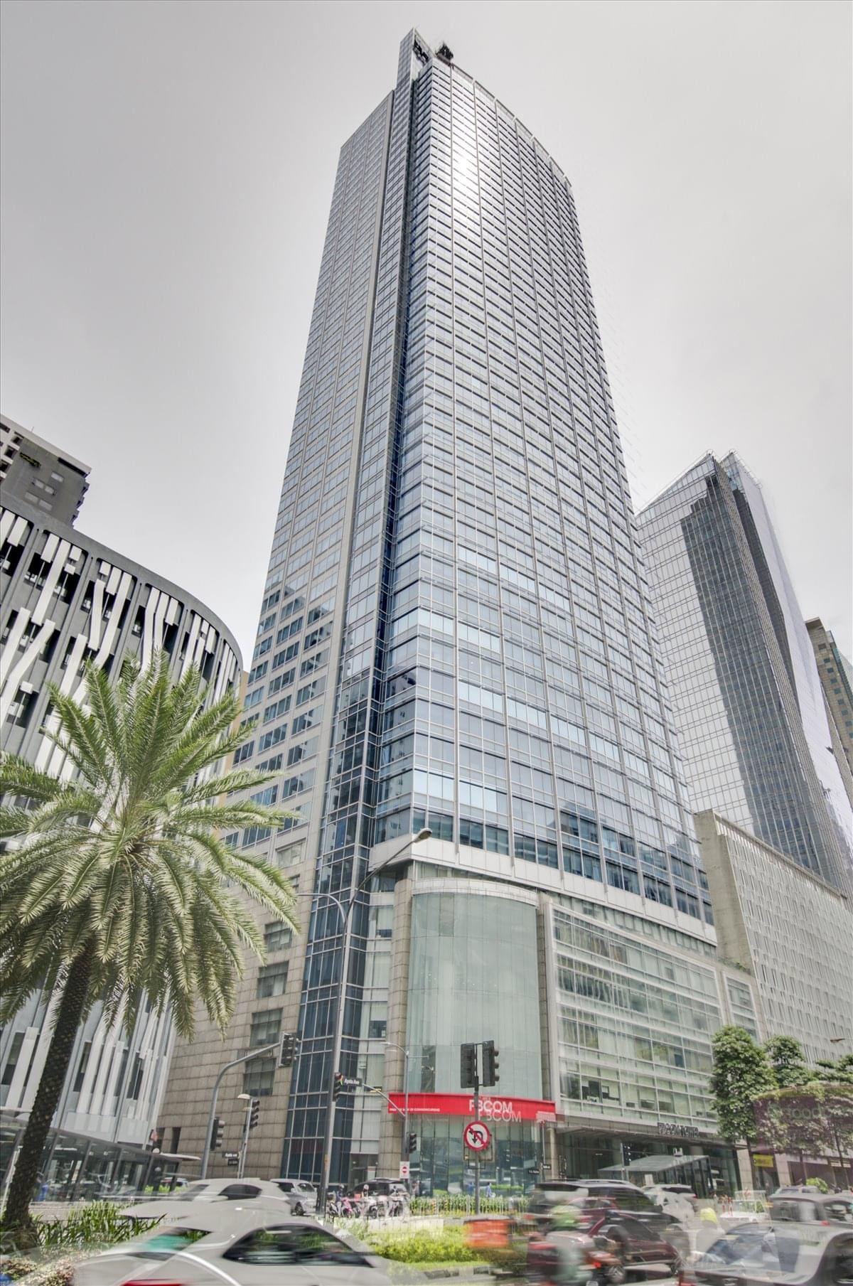 Exterior view of the soaring glass facade of PBCom Tower in Makati.