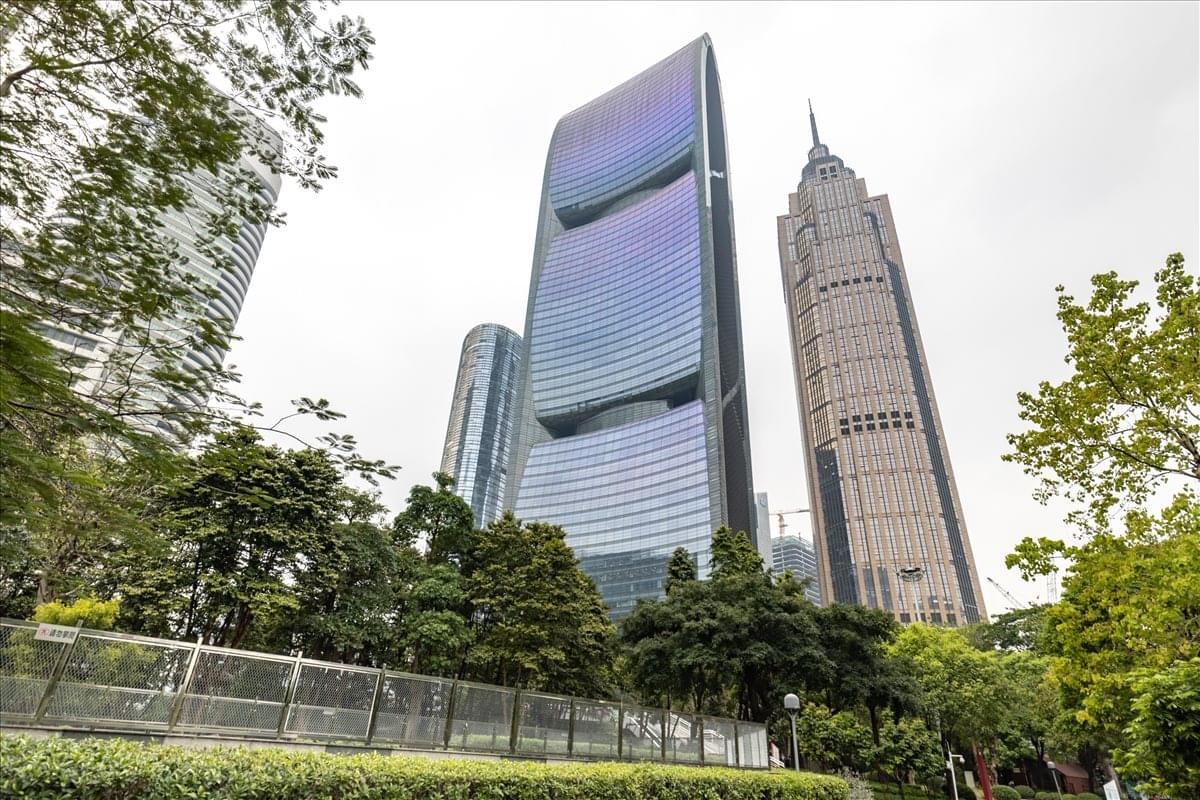 Exterior view of the striking glass facade and curved architectural design of the Pearl River Tower.