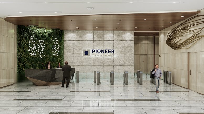 Main reception at Pioneer House BGC featuring a stone feature wall and security turnstiles.
