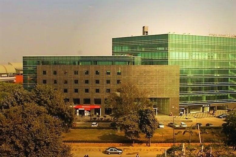 Exterior view of the modern glass-facade Platina building at M. G. Road.