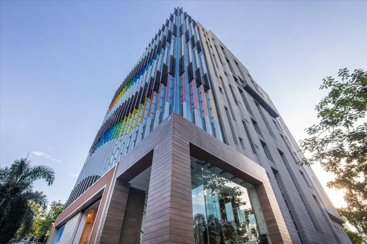 Exterior view of the modern glass and textured facade at PS Arcadia.