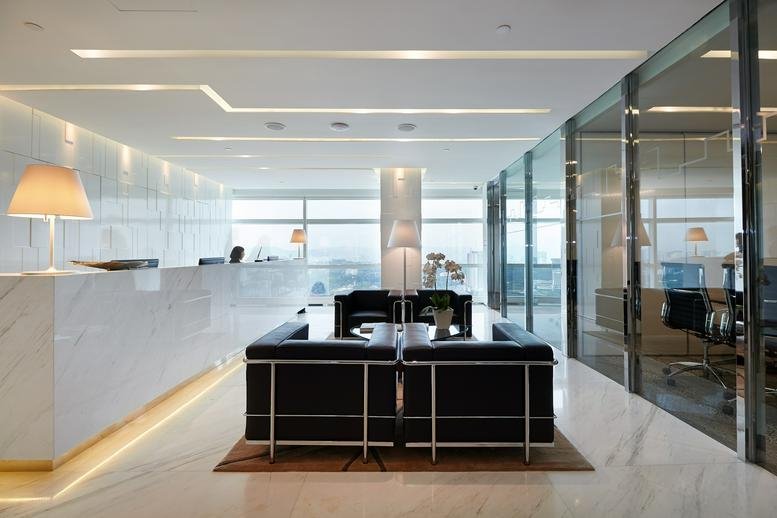 Modern marble reception desk with recessed lighting at 35th Floor, QSENTRAL, Jalan Stesen Sentral, KL Sentral.