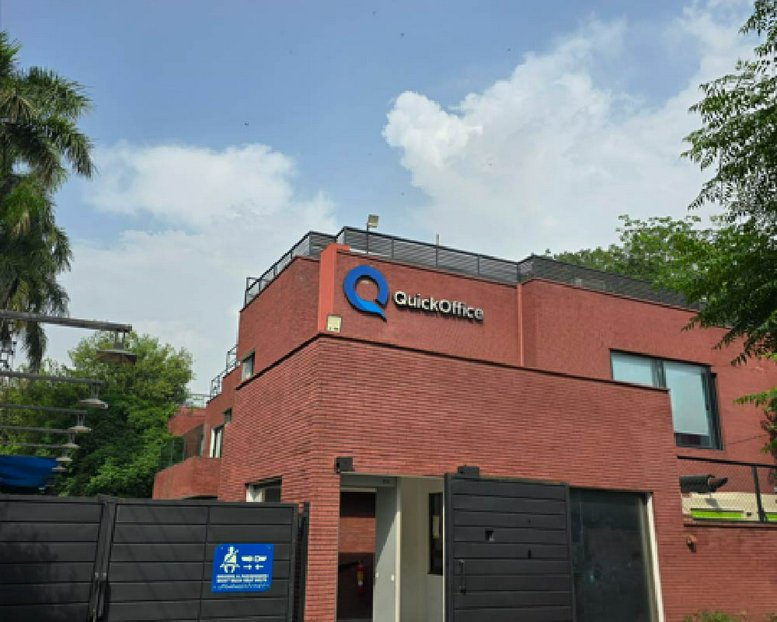 Exterior view of the red brick building facade at QuickOffice, 304 Upper Mall.