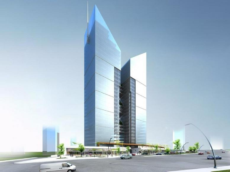 Exterior view of the modern glass-facade Koç İkiz Kuleler twin towers against a clear blue sky.