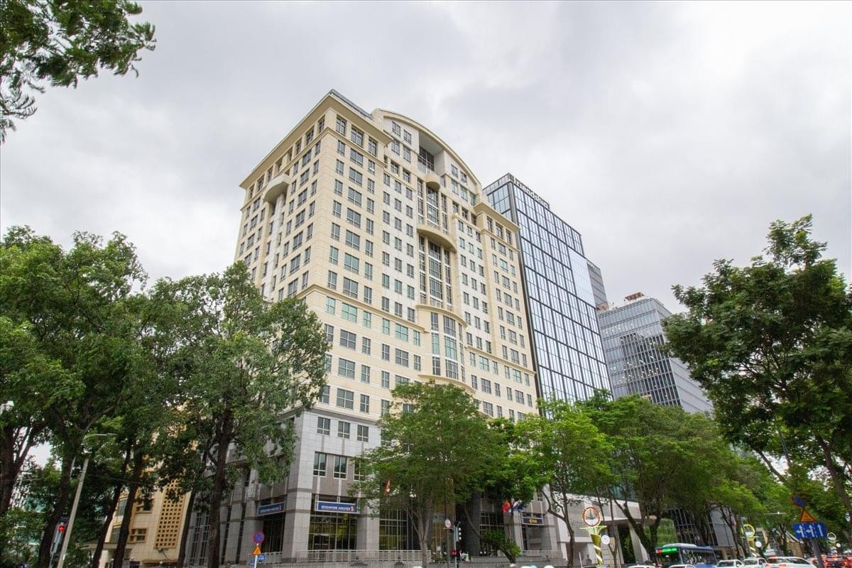 Exterior view of the classic stone facade at Saigon Tower on Le Duan Boulevard.