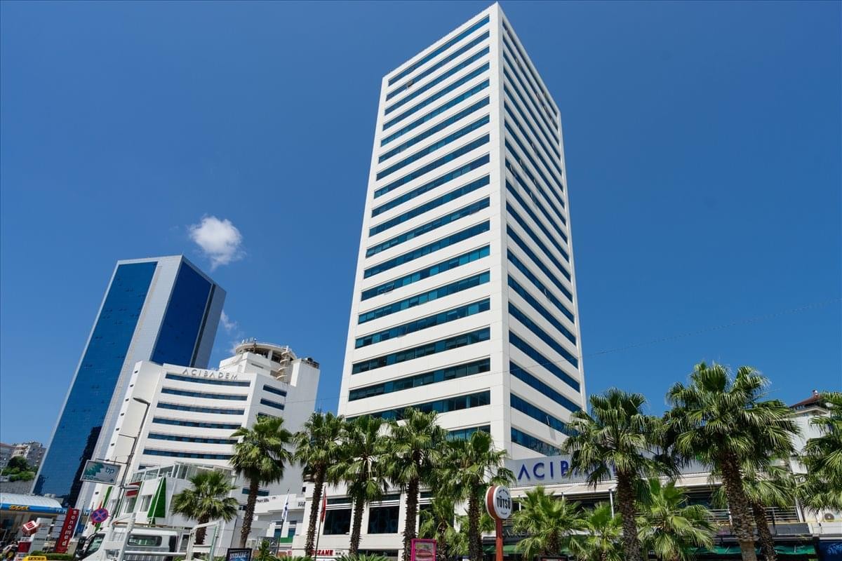 Exterior view of the white high-rise facade at Selenium Plaza.