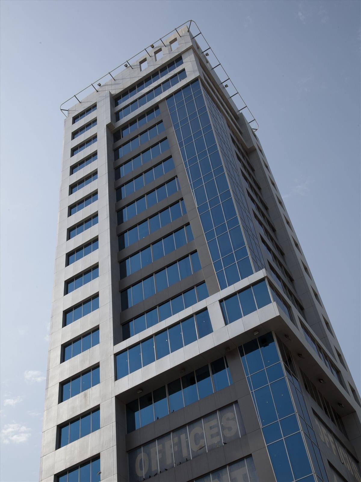 Exterior view of the glass-facade Shayma Tower, Omar Bin Al Khattab Street, Murgab.