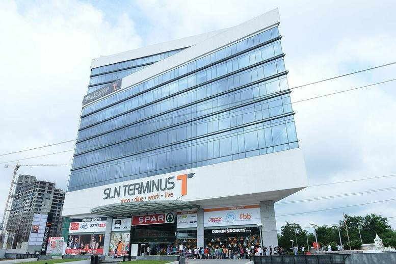 Exterior view of the modern glass-facade SLN Terminus building in Hyderabad.