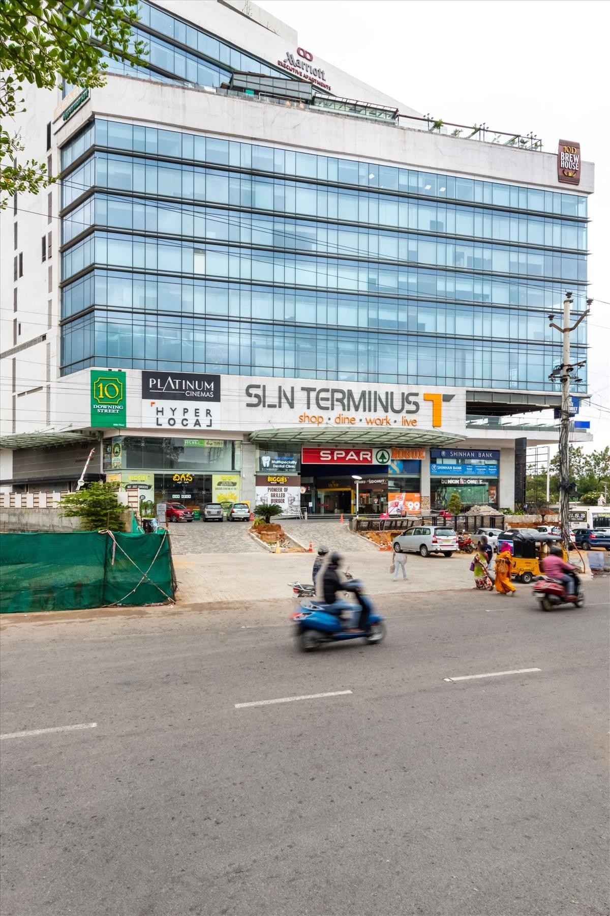 Sleek glass entrance and reception area at SLN Terminus.