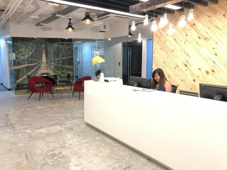 Reception area at the South Tower Rockwell Business Center Sheridan Tower 1 with a wood-slat feature wall.