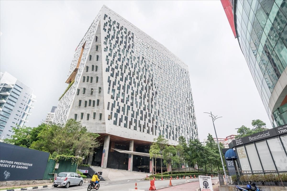 Exterior view of the uniquely patterned white facade of Menara OBYU building.